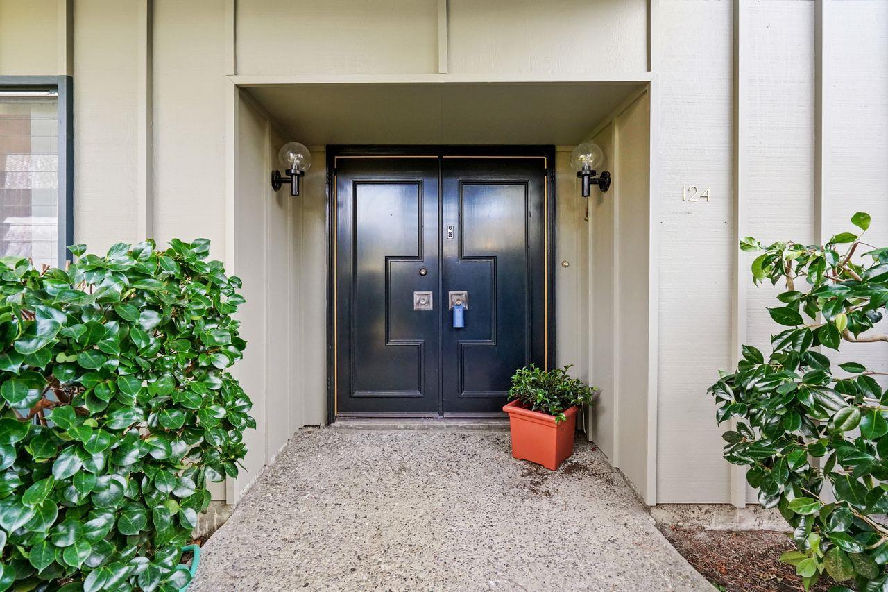 124 Del Mesa Carmel Carmel, CA 93923 - Photo 3 of 28 a front view of a house with potted plants