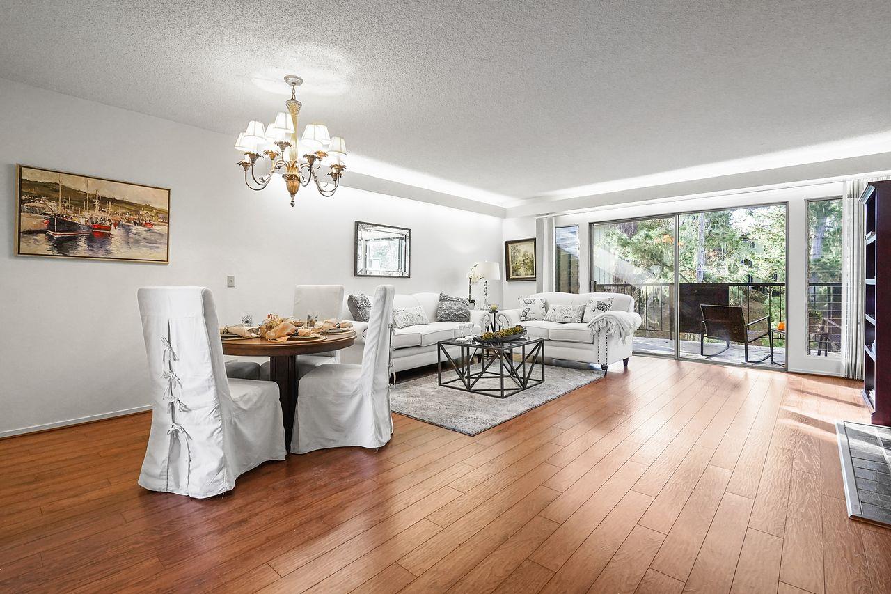124 Del Mesa Carmel Carmel, CA 93923 - Photo 4 of 28 a view of a dining room with furniture a chandelier and wooden floor