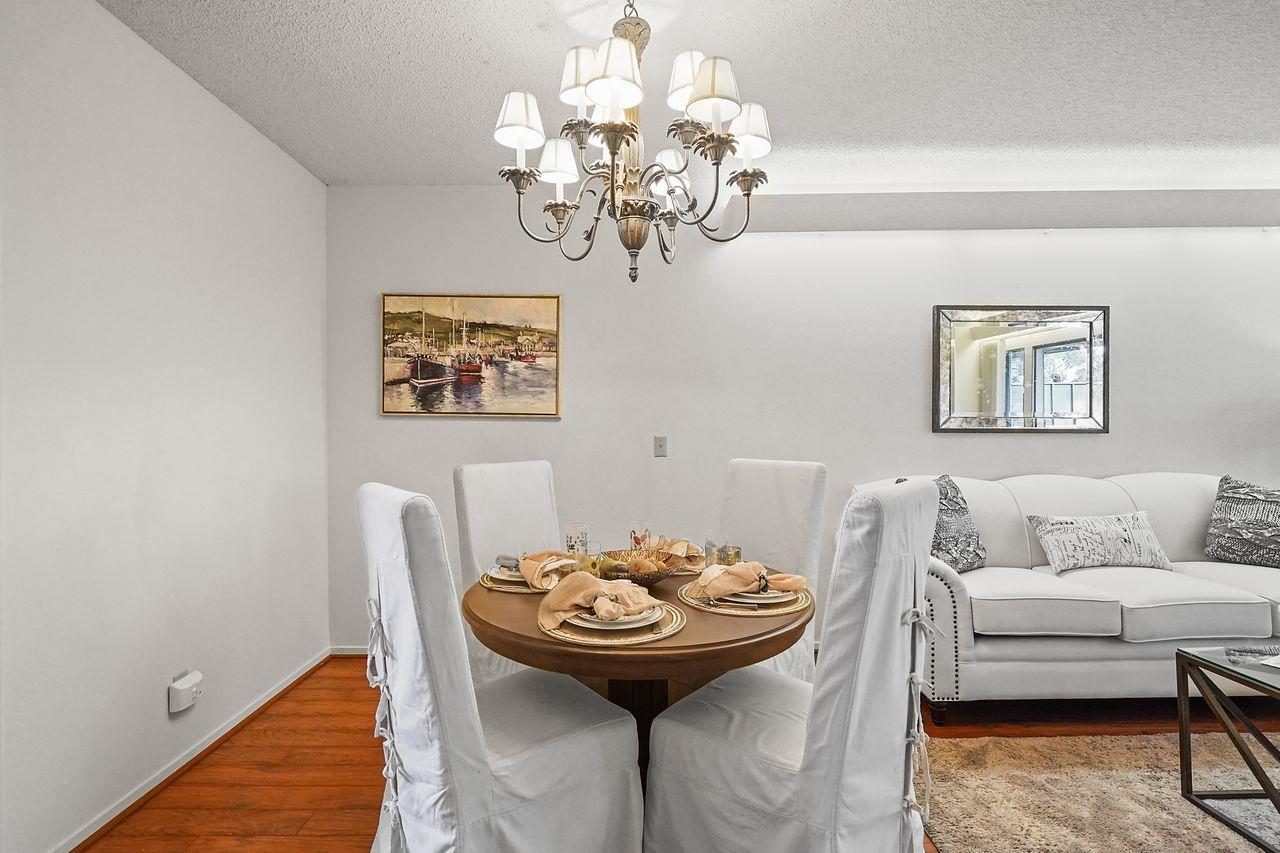 124 Del Mesa Carmel Carmel, CA 93923 - Photo 7 of 28 a view of a dining room with furniture and chandelier