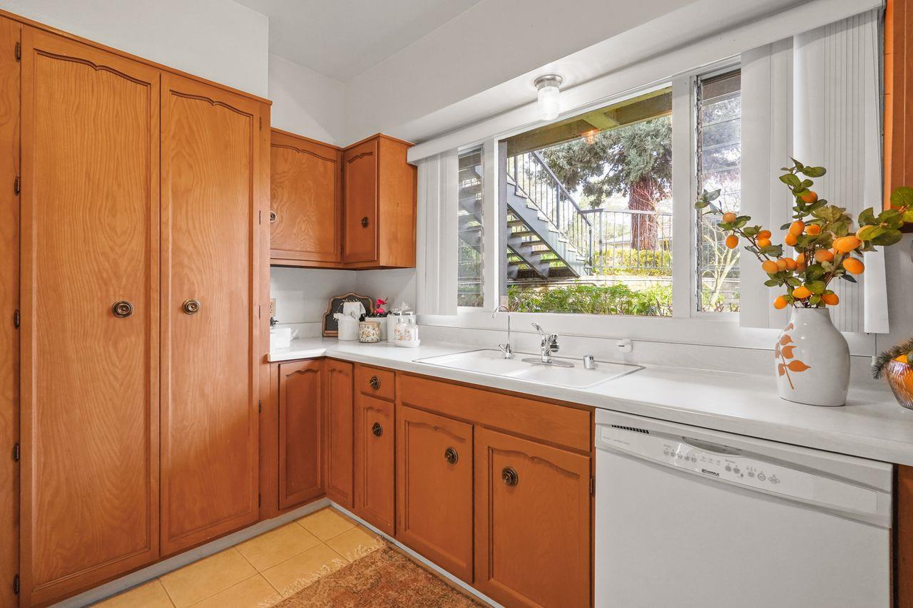 124 Del Mesa Carmel Carmel, CA 93923 - Photo 9 of 28 a kitchen with a sink cabinets and window
