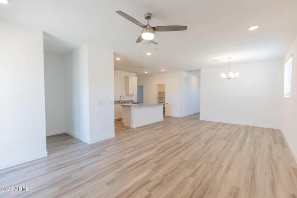 a view of a kitchen with a sink and a refrigerator