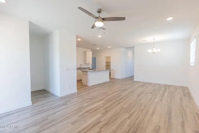 a view of a kitchen with a sink and a refrigerator