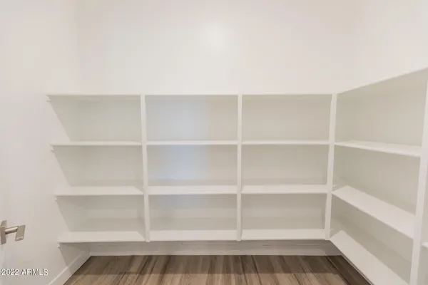 a view of a room with shelf on the wall