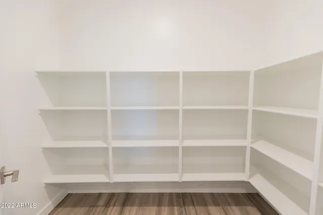 a view of a room with shelf on the wall