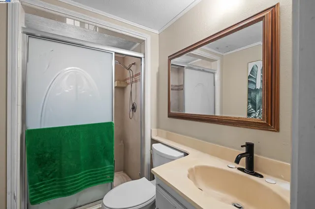 a bathroom with a sink toilet and mirror