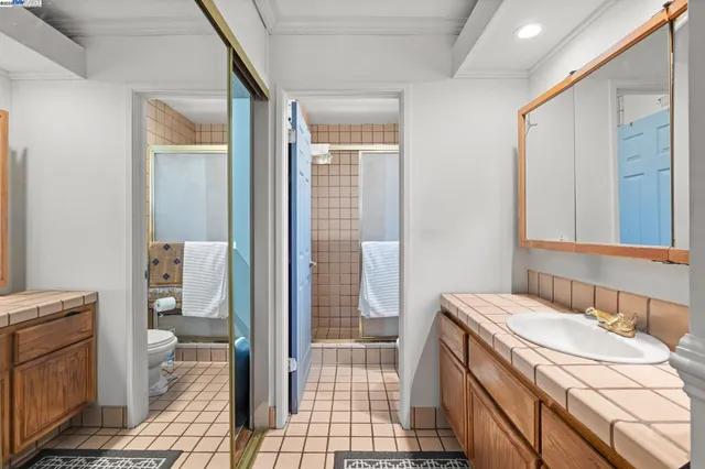 a bathroom with a sink a mirror and a shower