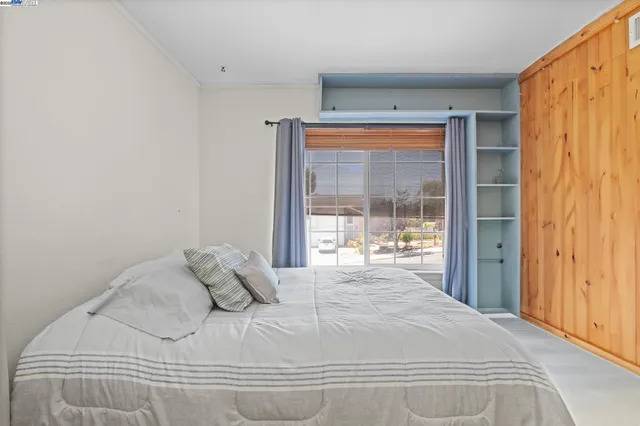 a large white bed in a white room