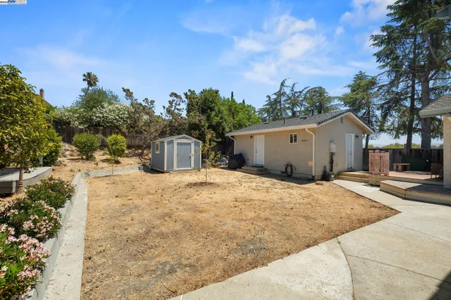 a backyard of a house with lots of green space