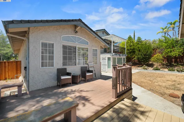 a view of a kitchen with a sink wooden floor and windows