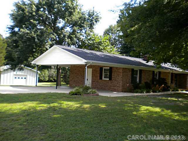 4604 Morgan Mill Road Monroe, NC 28110 - Photo 1 of 9 a front view of a house with a yard