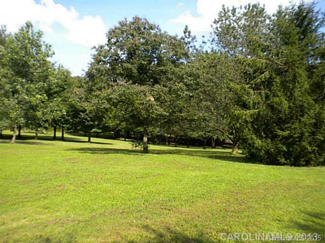 4604 Morgan Mill Road Monroe, NC 28110 - Photo 3 of 9 a view of a swimming pool with an outdoor space and seating area