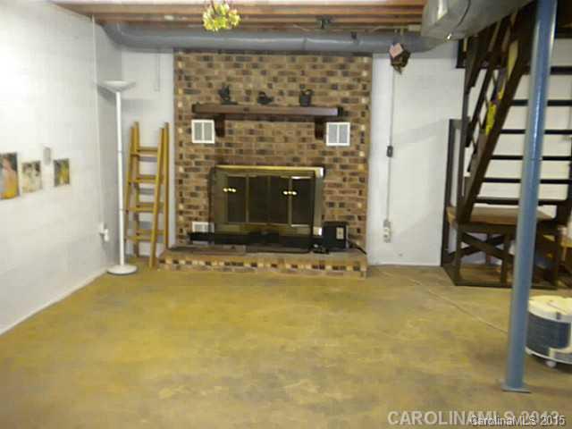 4604 Morgan Mill Road Monroe, NC 28110 - Photo 8 of 9 a view of an empty room with a fireplace