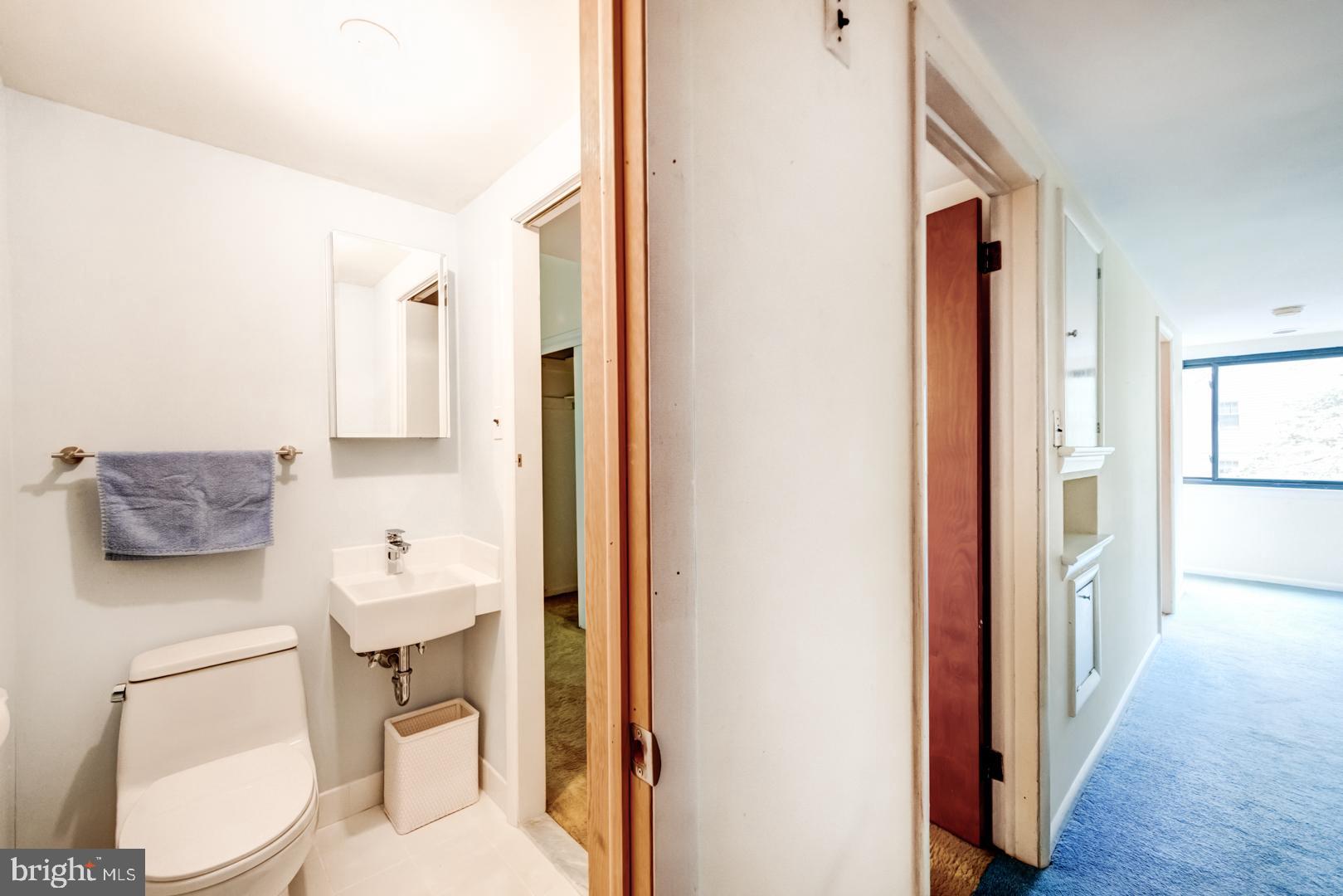 675 Malin Road Newtown Square, PA 19073 - Photo 31 of 44 Powder room open to hall and primary bedroom