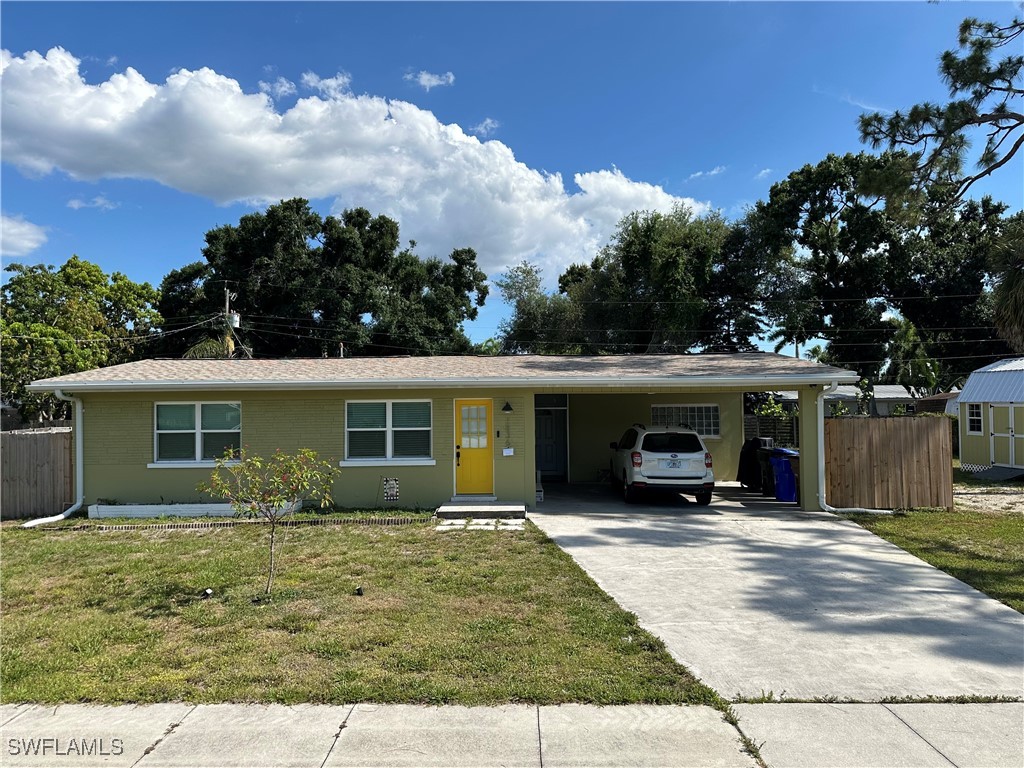 1836 Collier Avenue Fort Myers, FL 33901 - Photo 2 of 19 front view of a house with a patio