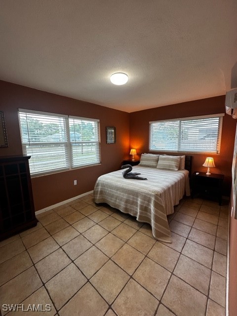 1836 Collier Avenue Fort Myers, FL 33901 - Photo 8 of 19 a bedroom with a bed and window