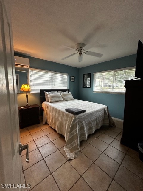 1836 Collier Avenue Fort Myers, FL 33901 - Photo 9 of 19 a bedroom with a bed and a flat screen tv