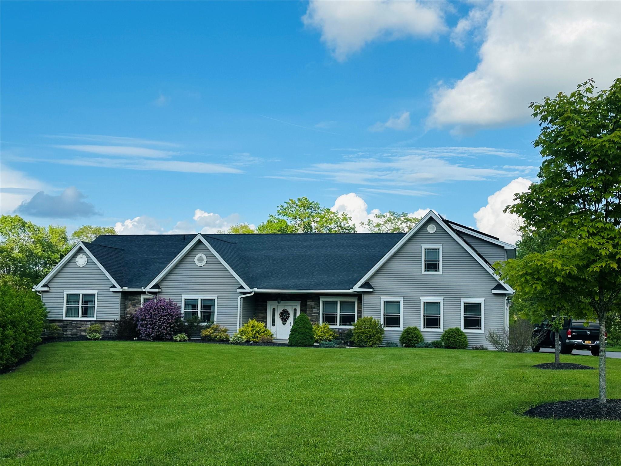 a front view of a house with a yard