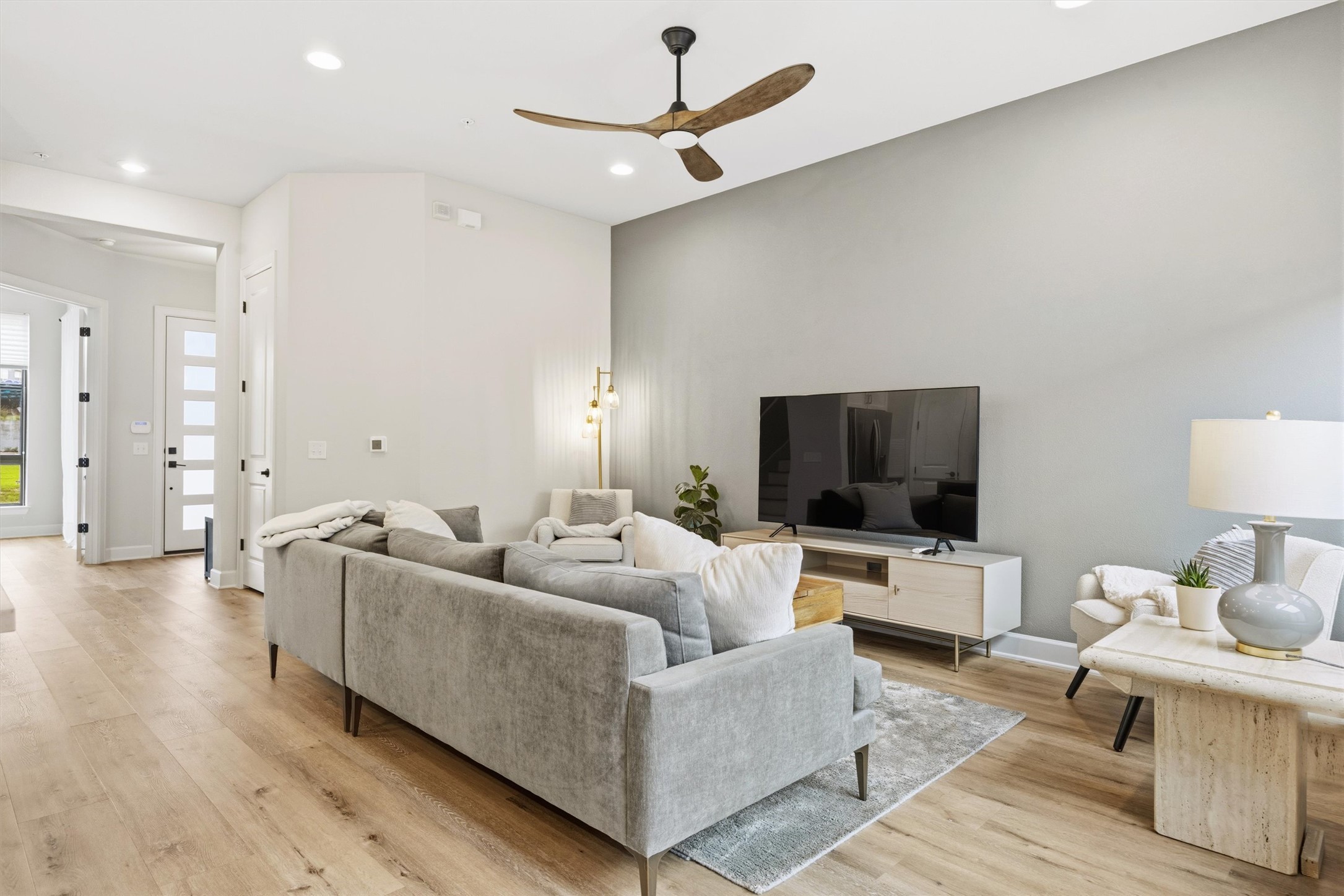 4704 Eberly Street Austin, TX 78723 - Photo 10 of 39 a living room with furniture and a flat screen tv