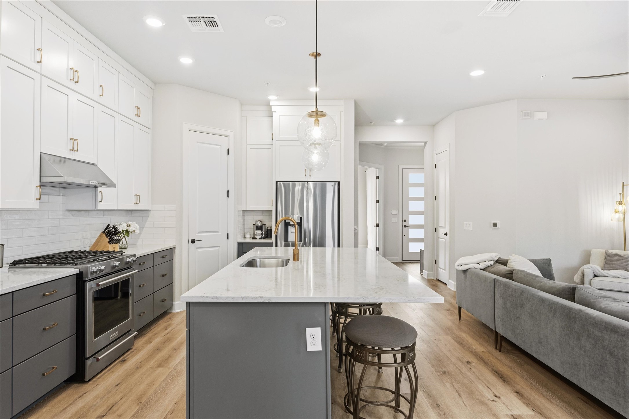 4704 Eberly Street Austin, TX 78723 - Photo 11 of 39 a large kitchen with stainless steel appliances lots of counter space and breakfast area