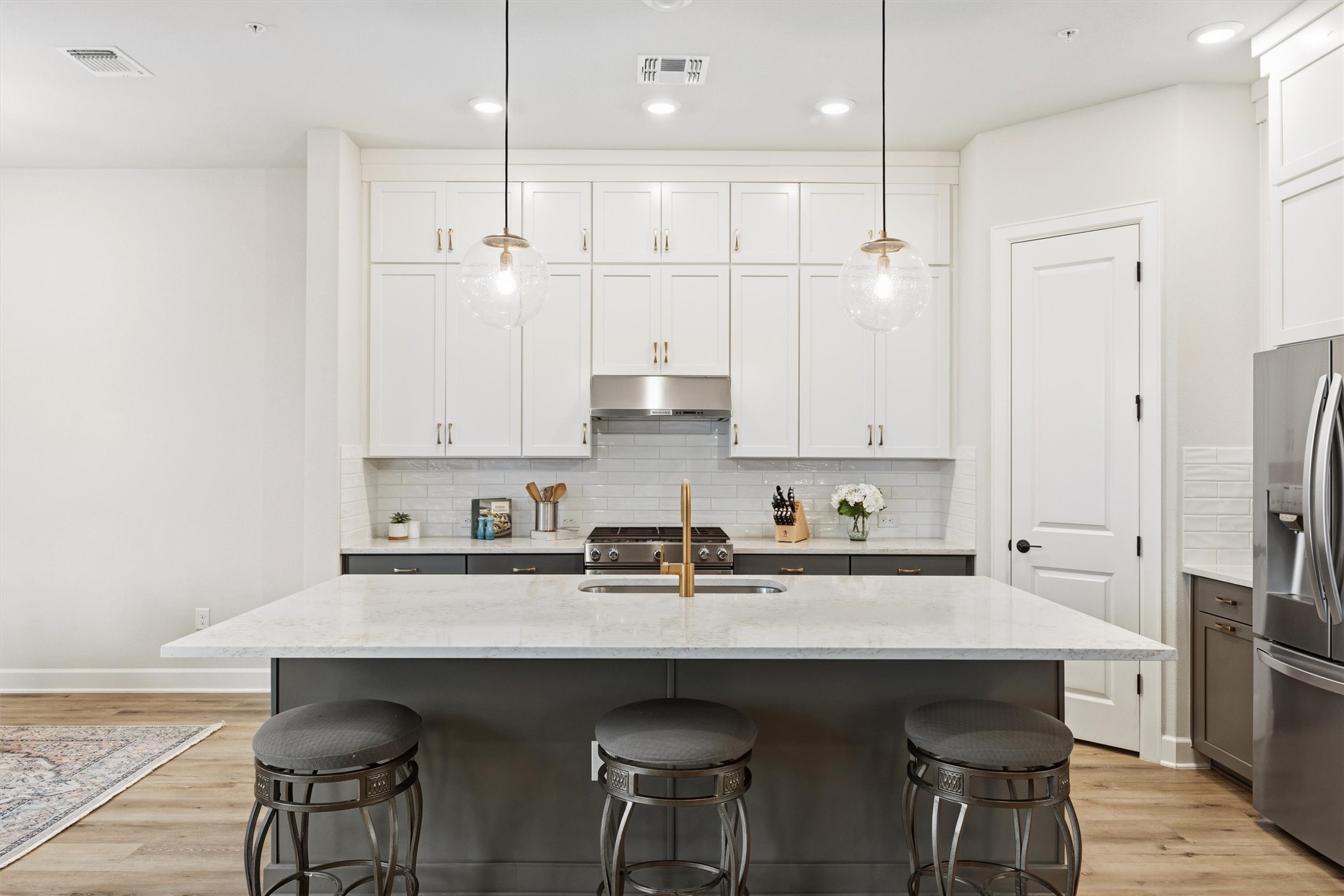 4704 Eberly Street Austin, TX 78723 - Photo 12 of 39 a kitchen with stainless steel appliances a sink and cabinets
