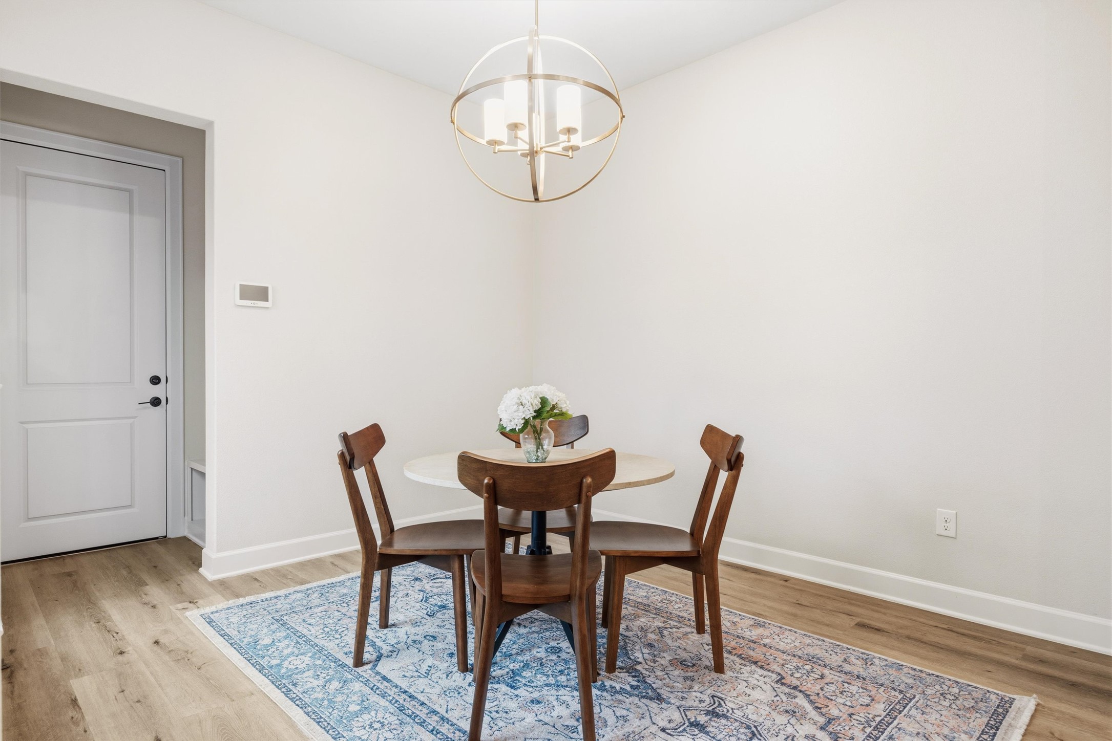 4704 Eberly Street Austin, TX 78723 - Photo 15 of 39 a view of a dining room with furniture and wooden floor