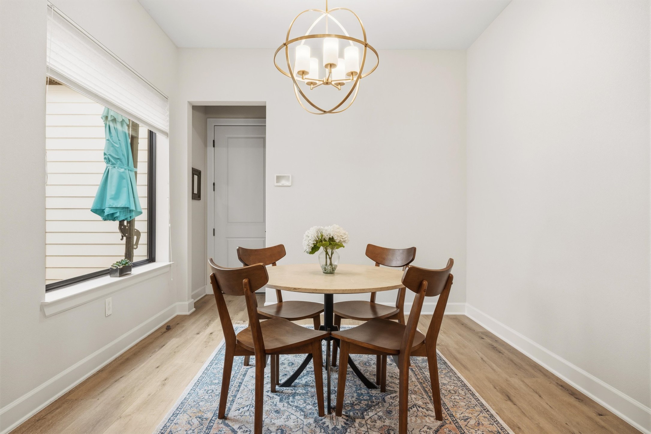 4704 Eberly Street Austin, TX 78723 - Photo 16 of 39 a view of a dining room with furniture window and wooden floor