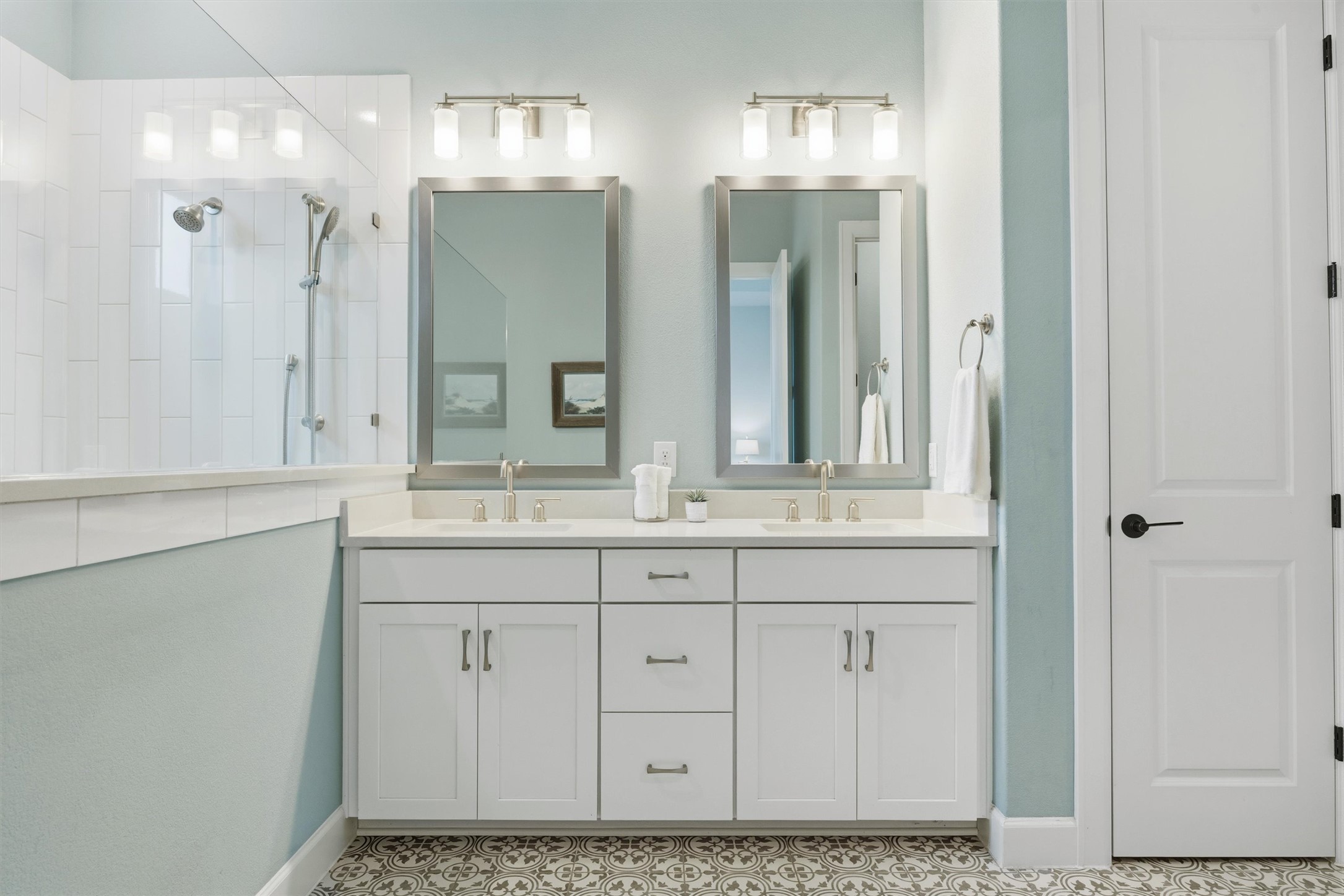 4704 Eberly Street Austin, TX 78723 - Photo 20 of 39 a bathroom with double vanity sink and a mirror