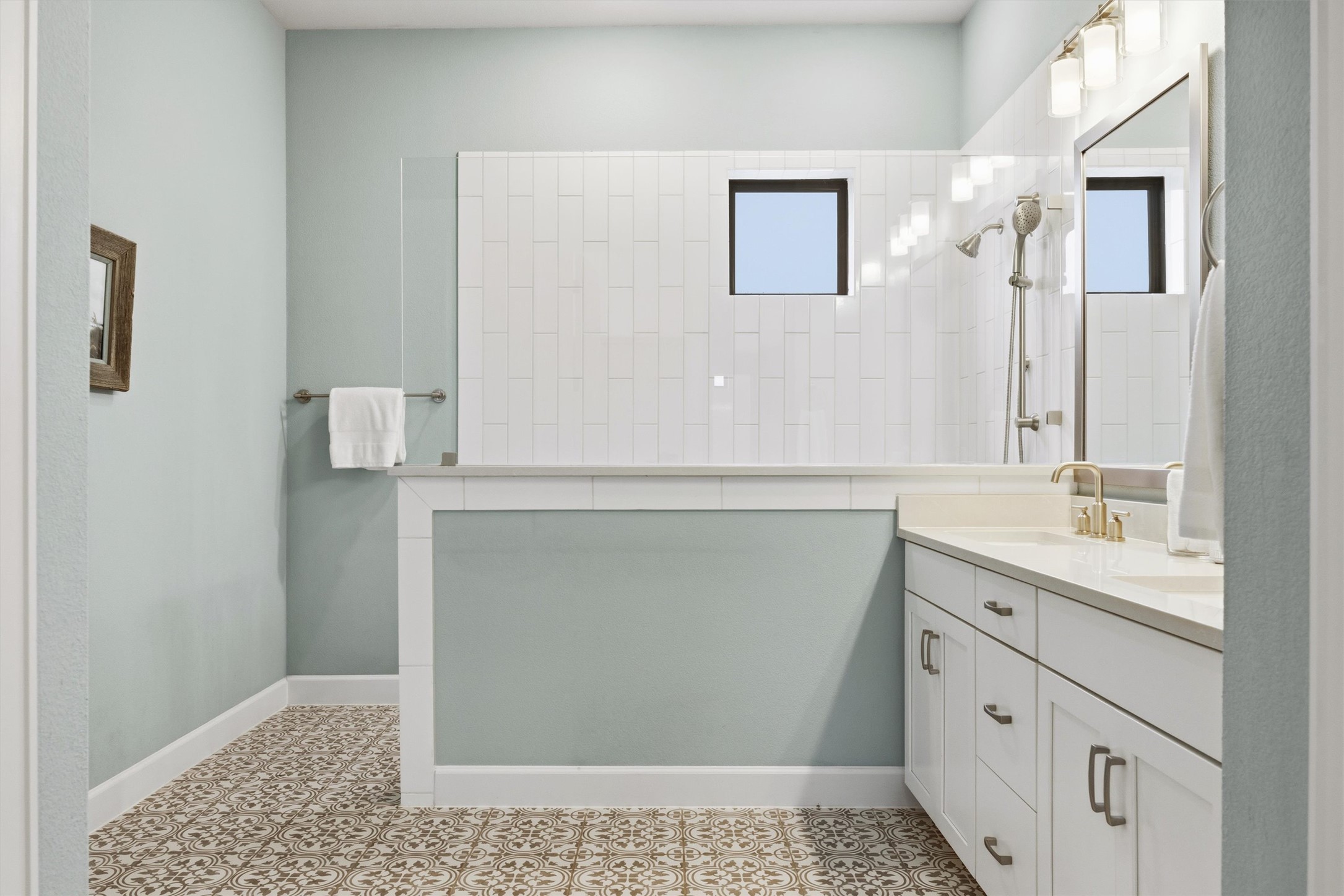 4704 Eberly Street Austin, TX 78723 - Photo 22 of 39 a bathroom with a sink a toilet and mirror
