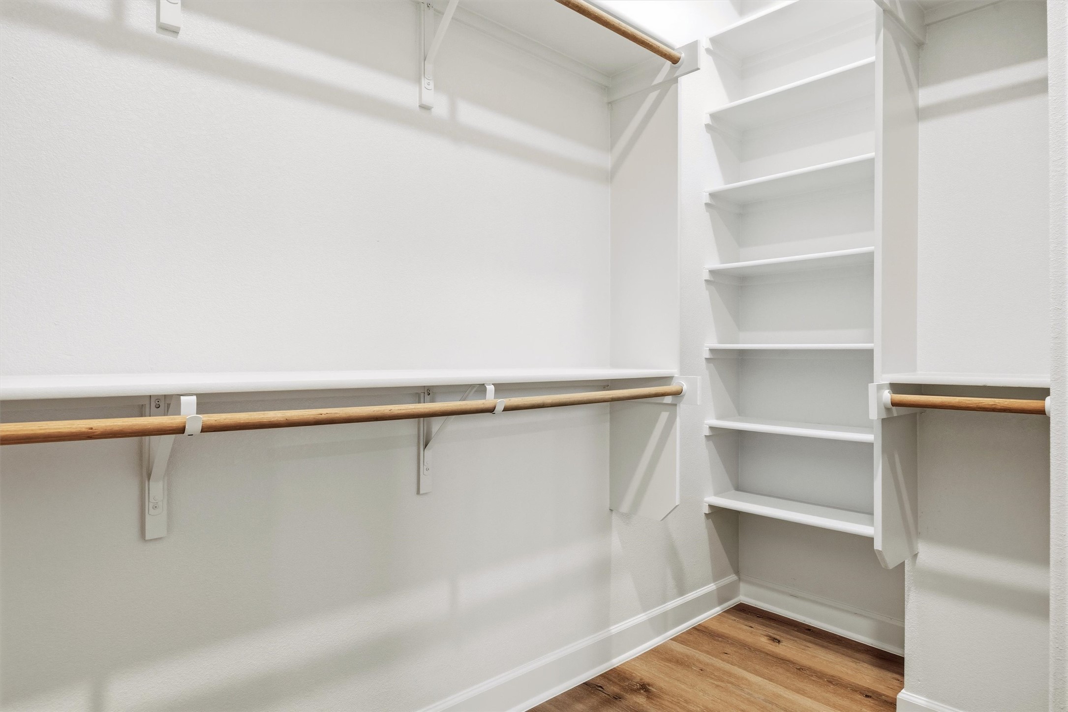 4704 Eberly Street Austin, TX 78723 - Photo 23 of 39 a view of walk in closet with empty racks