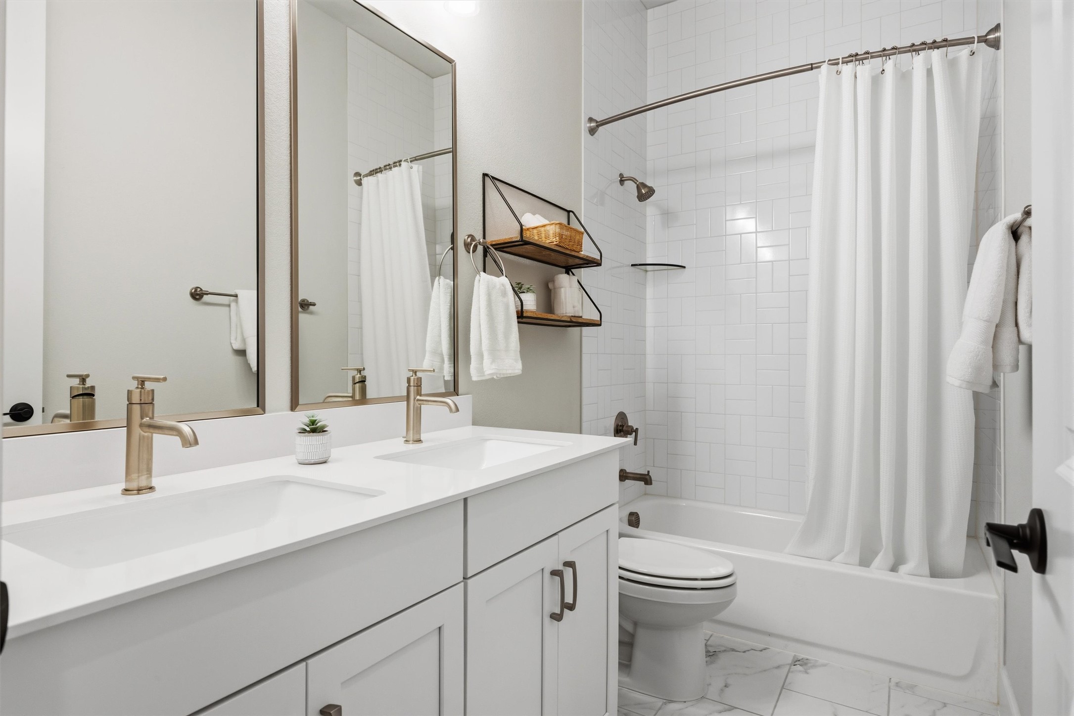 4704 Eberly Street Austin, TX 78723 - Photo 30 of 39 a bathroom with a sink a toilet and shower