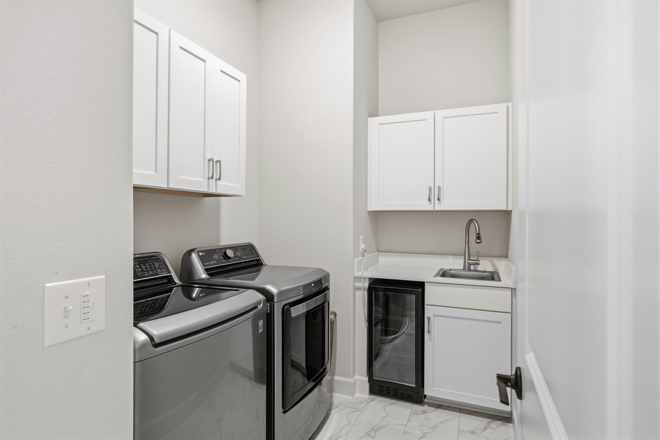4704 Eberly Street Austin, TX 78723 - Photo 31 of 39 a utility room with sink dryer and washer