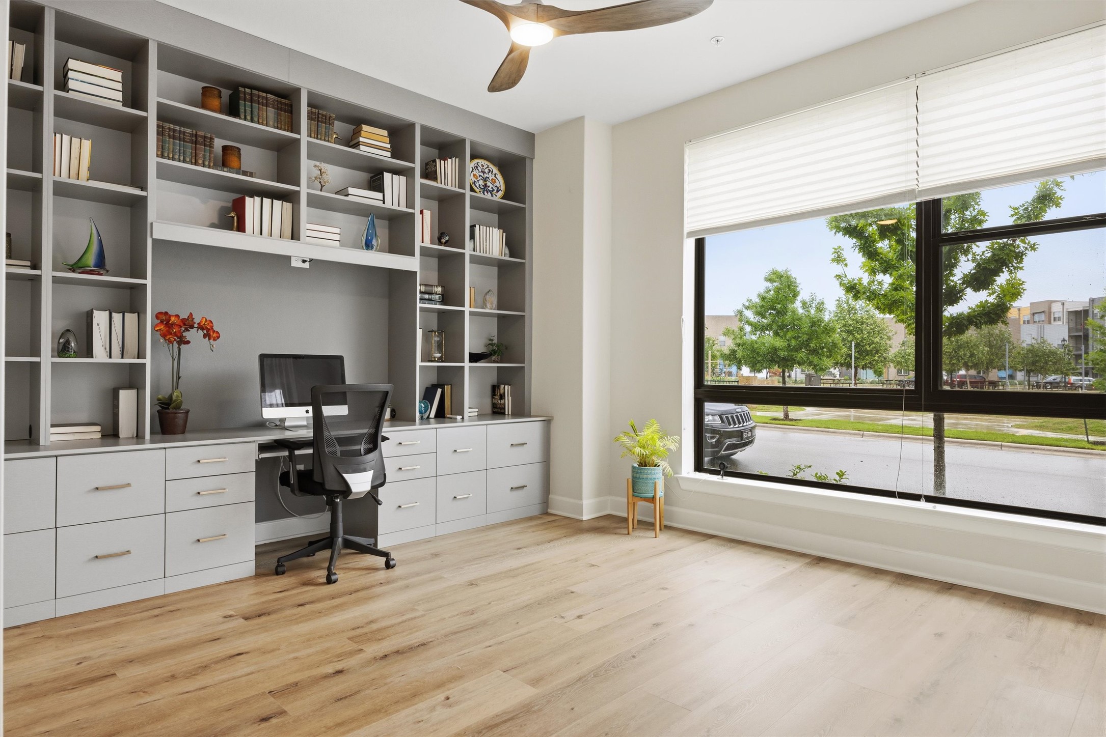 4704 Eberly Street Austin, TX 78723 - Photo 4 of 39 a view of a workspace with furniture and a large window
