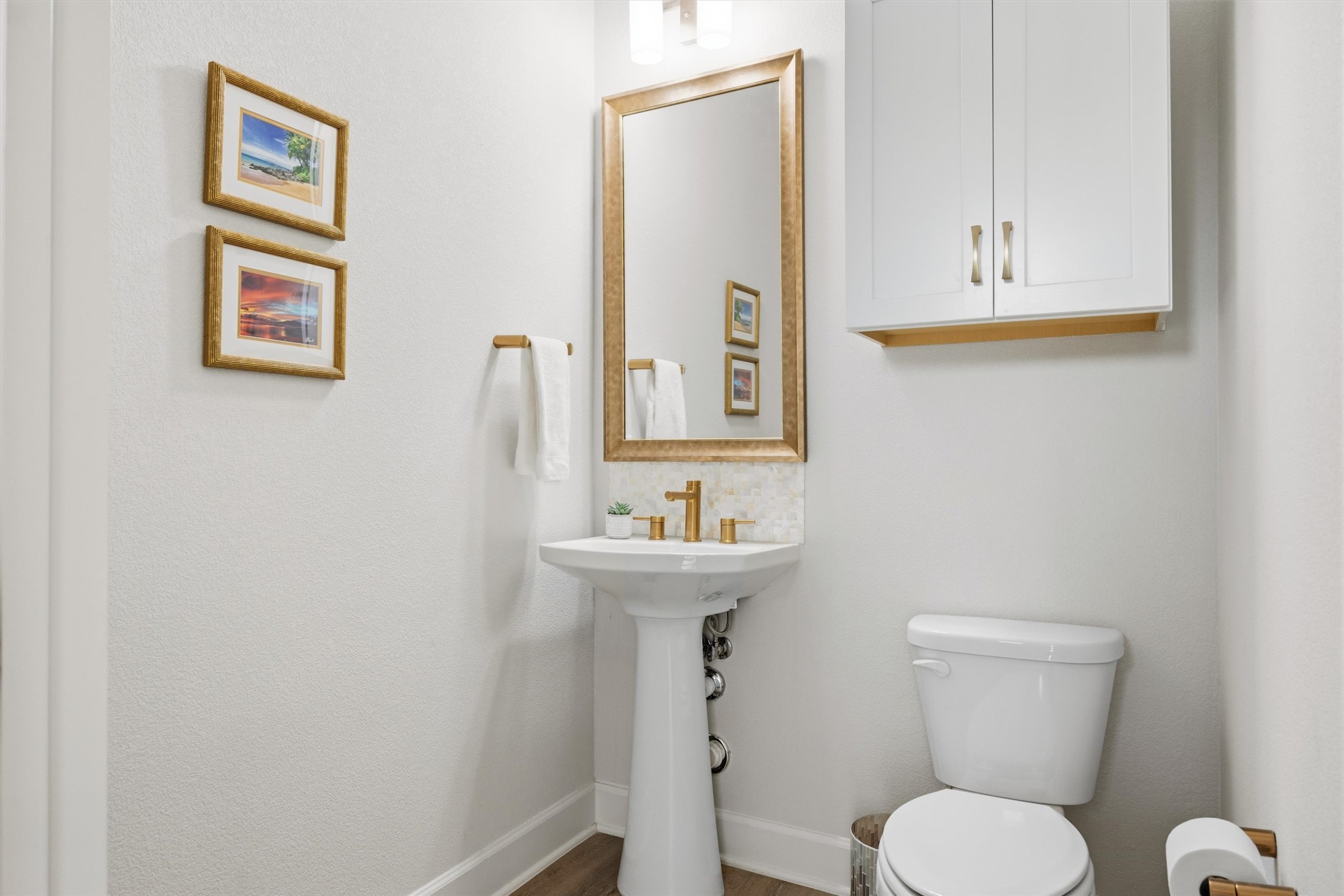 4704 Eberly Street Austin, TX 78723 - Photo 7 of 39 a bathroom with a toilet a sink and mirror