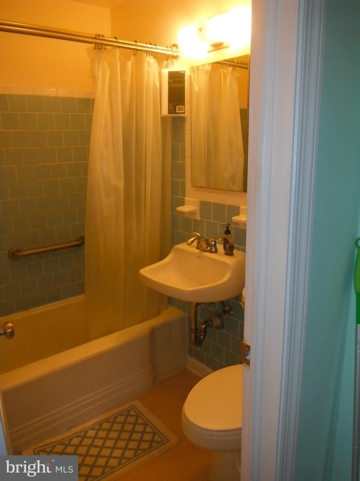 12308 Veirs Mill Road Silver Spring, MD 20906 - Photo 20 of 25 a bathroom with a sink a toilet and shower