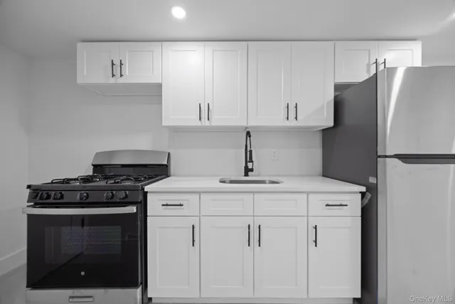 a kitchen with cabinets and appliances