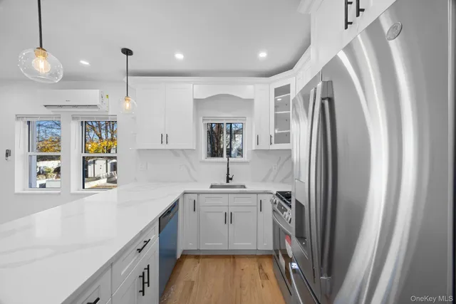 a kitchen with refrigerator a sink and cabinets