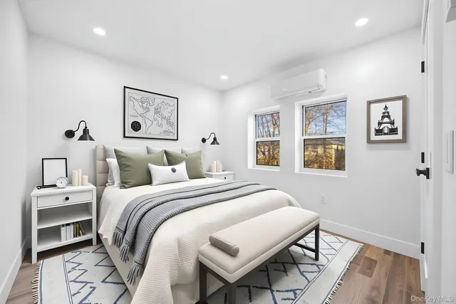 a bedroom with a bed and a table