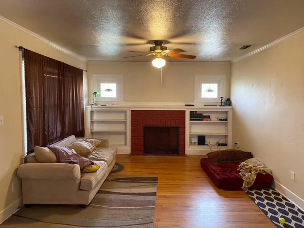 a living room with furniture and a fireplace