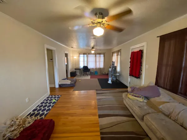 a kitchen with stainless steel appliances a stove a sink and a refrigerator