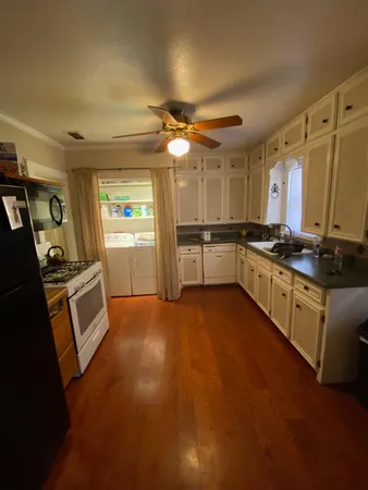 a bedroom with furniture and wooden floor
