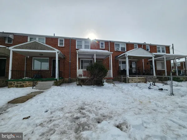 a front view of a house with yard and porch