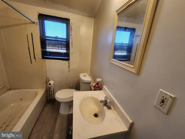 a bathroom with a sink a bathtub and a shower