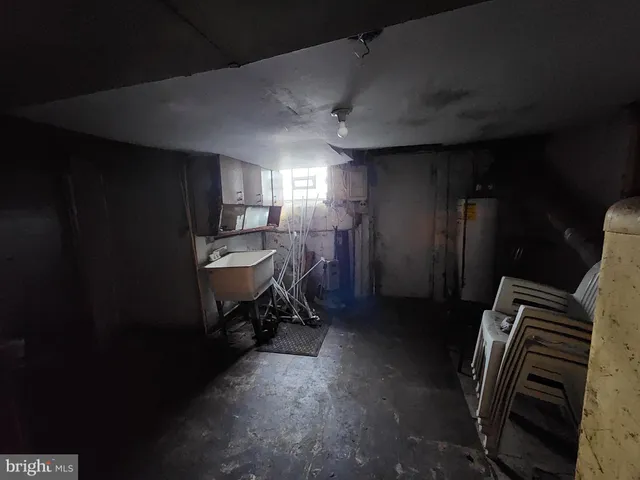 a room with chairs and a refrigerator