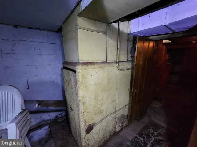 a view of an chair and table in backyard