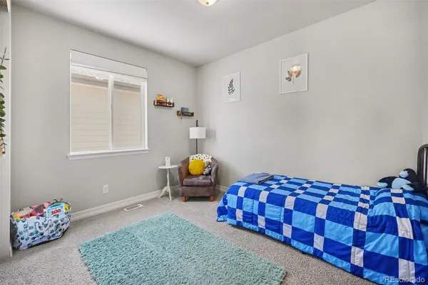 a bedroom with bed and window