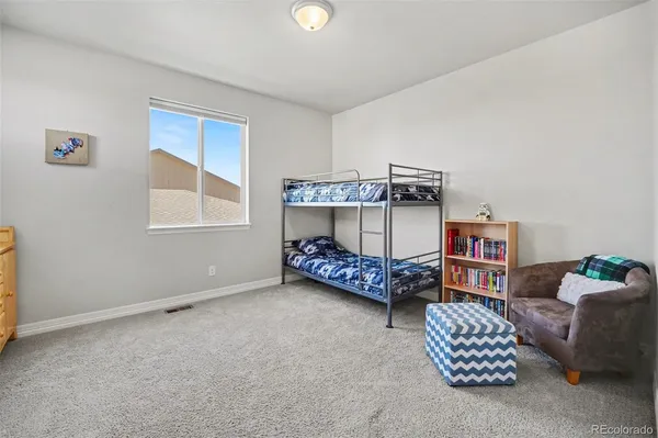 a bedroom with furniture and a window