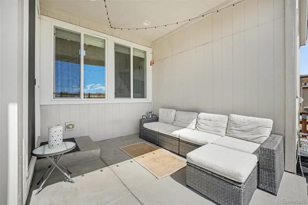 a living room with furniture and a window