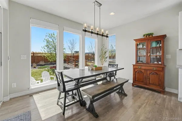 a living room with furniture a window and a flat screen tv