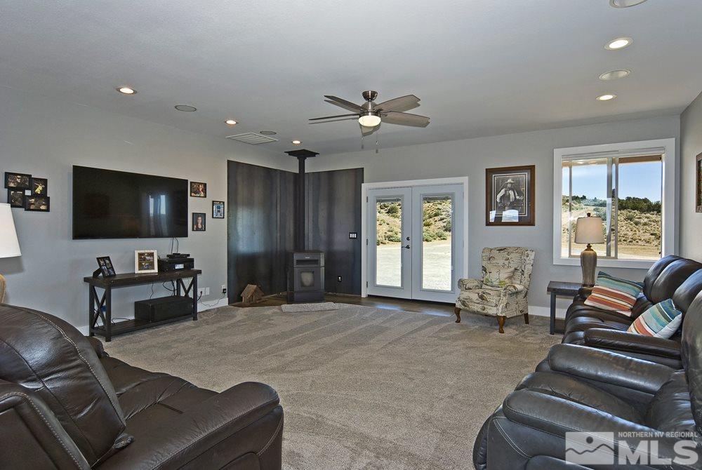 1375 Freds Mountain Road Reno, NV 89508 - Photo 12 of 40 a living room with furniture and a flat screen tv