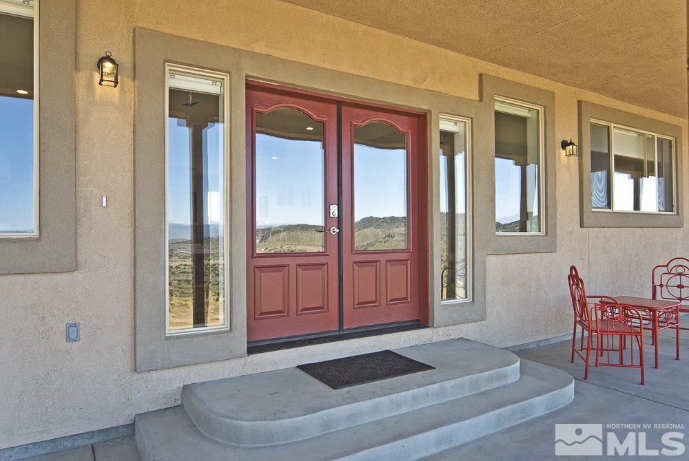 1375 Freds Mountain Road Reno, NV 89508 - Photo 2 of 40 a living room with furniture and a window
